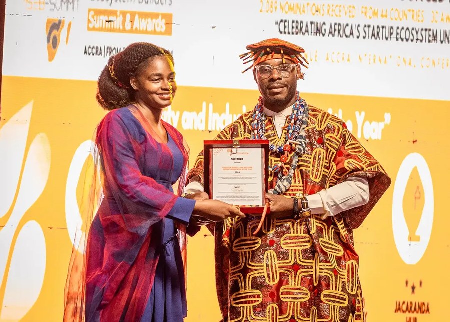 Vanessa Kisowile receiving the ASEB Award for SheFound